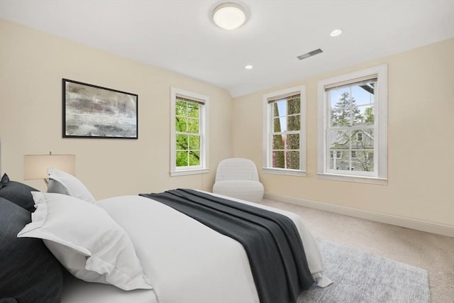 bedroom featuring carpet floors, recessed lighting, visible vents, and baseboards