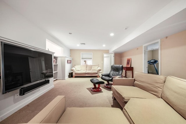 living room featuring visible vents, baseboards, carpet flooring, and recessed lighting