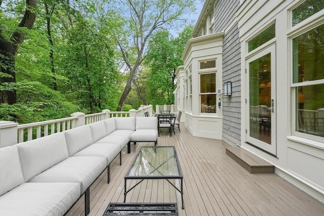 deck with outdoor dining area and an outdoor living space