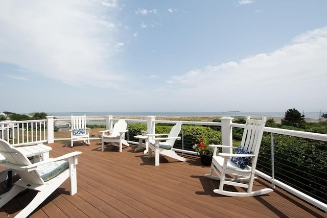 wooden deck featuring a water view