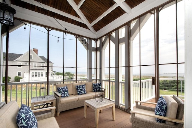 sunroom with lofted ceiling and wood ceiling