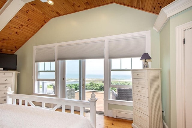 bedroom featuring lofted ceiling, wood ceiling, and light hardwood / wood-style flooring