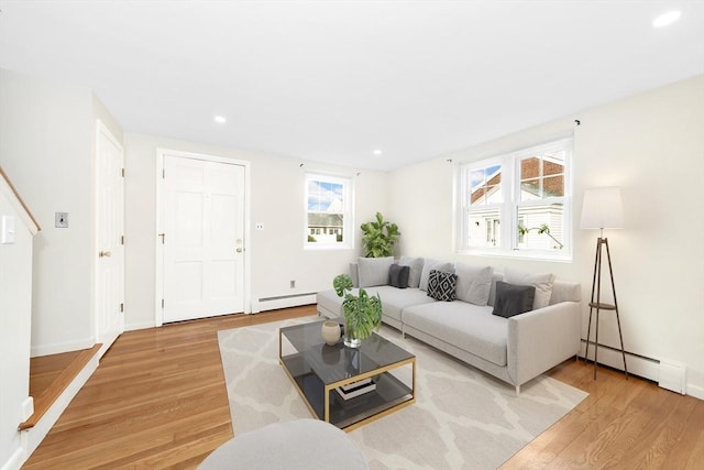 living room featuring hardwood / wood-style flooring and a baseboard radiator