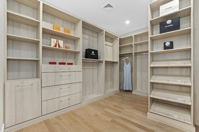 walk in closet featuring light hardwood / wood-style floors