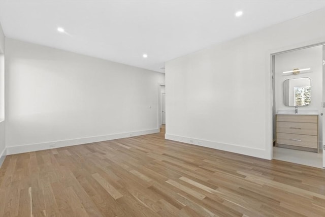 unfurnished room with light hardwood / wood-style floors