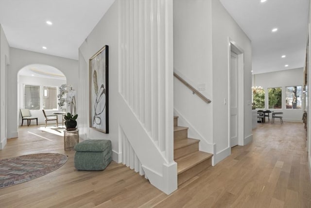 interior space featuring hardwood / wood-style flooring and a chandelier