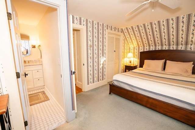 14 N Pleasant St, Dartmouth, MA 02748 - carpeted bedroom with wallpapered walls, a closet, and a ceiling fan