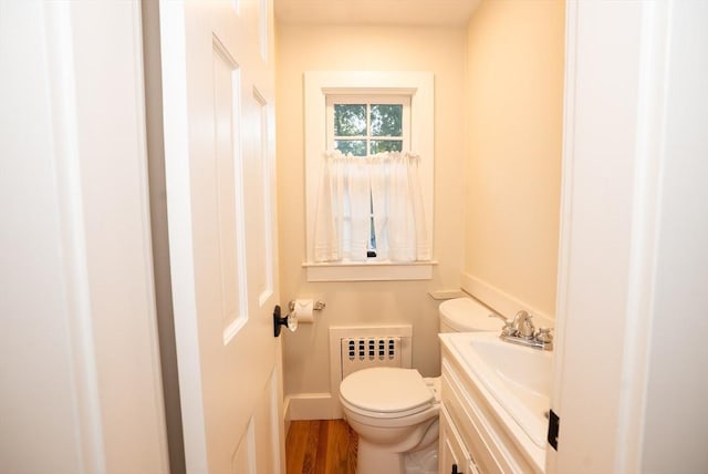 14 N Pleasant St, Dartmouth, MA 02748 - bathroom featuring vanity, wood finished floors, and radiator heating unit