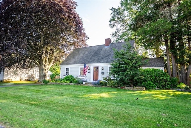 14 N Pleasant St, Dartmouth, MA 02748 - cape cod home with a chimney, a front yard, and roof with shingles