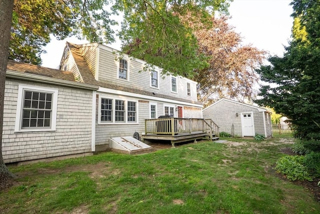14 N Pleasant St, Dartmouth, MA 02748 - rear view of house with a wooden deck, a lawn, a storage shed, and roof with shingles