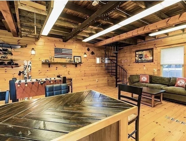 recreation room featuring hardwood / wood-style flooring, beamed ceiling, wood ceiling, and wood walls