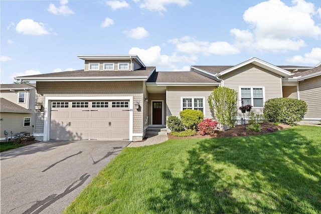 46 Walden Way Unit 46, Milford, MA 01757 - view of front of home featuring a front lawn, an attached garage, and asphalt driveway
