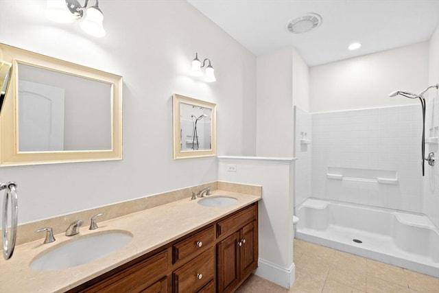 46 Walden Way Unit 46, Milford, MA 01757 - bathroom with a shower, double vanity, tile patterned floors, and toilet