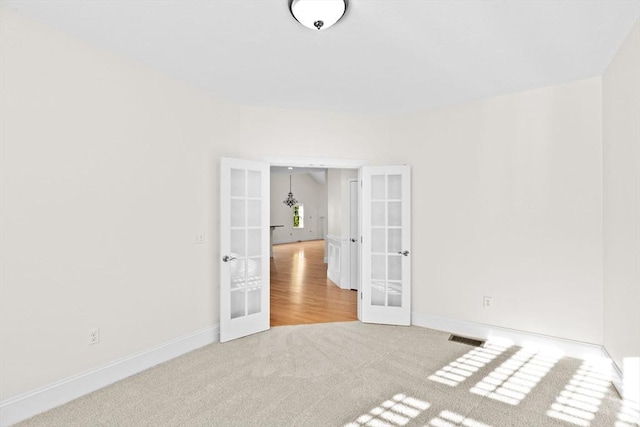 46 Walden Way Unit 46, Milford, MA 01757 - spare room with french doors, carpet, and baseboards