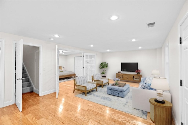 46 Walden Way Unit 46, Milford, MA 01757 - living area with wood finished floors, stairway, baseboards, and recessed lighting