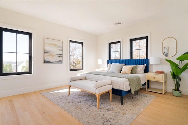 bedroom with light hardwood / wood-style floors