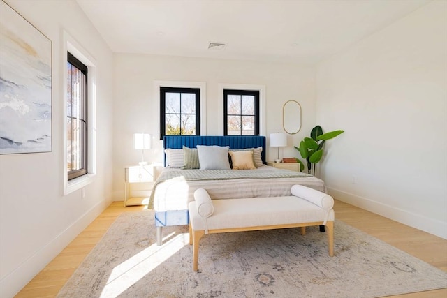 bedroom with light hardwood / wood-style floors