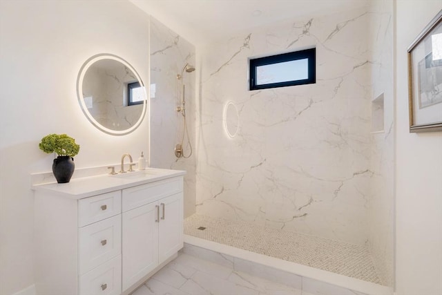 bathroom featuring vanity and tiled shower