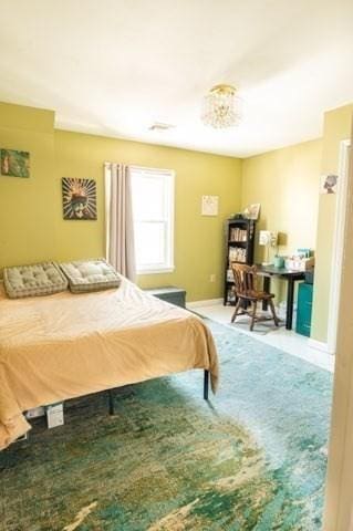 bedroom featuring baseboards