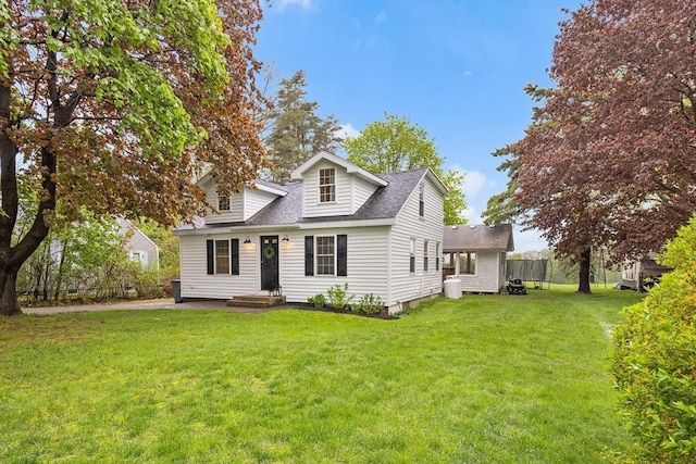 cape cod home with a front lawn and roof with shingles
