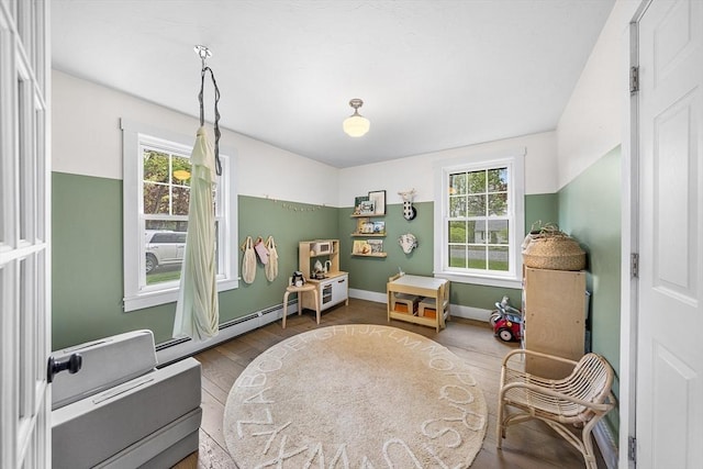 game room featuring wood finished floors and baseboards
