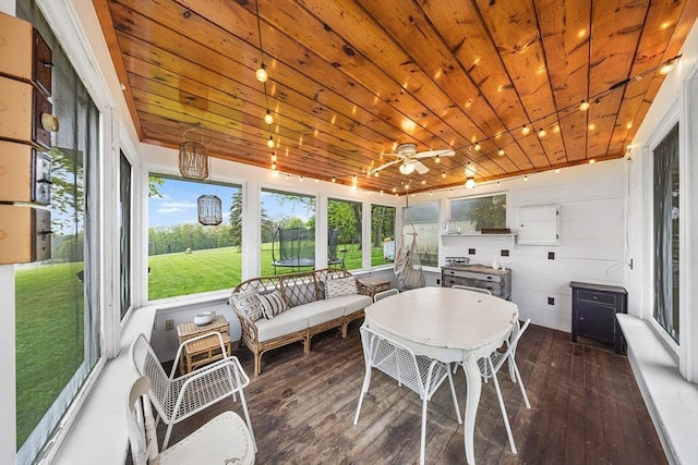 sunroom / solarium with hardwood / wood-style floors, ceiling fan, and wood ceiling