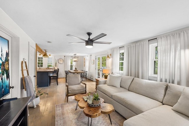 living area featuring ceiling fan and light wood-type flooring