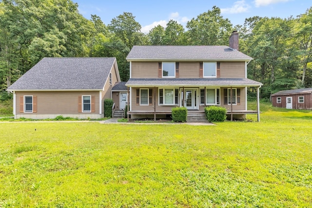 view of front of home featuring a front lawn and covered porch