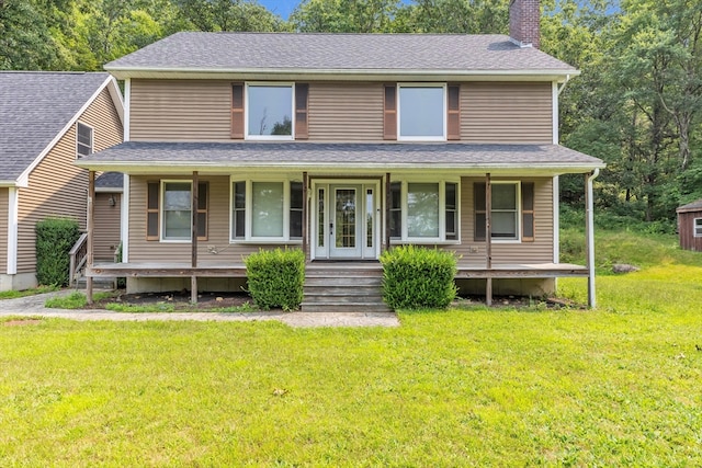 view of front of house featuring a front yard and covered porch