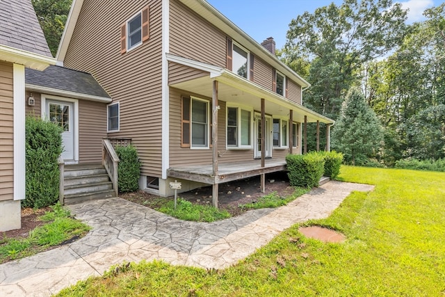 back of house with a yard