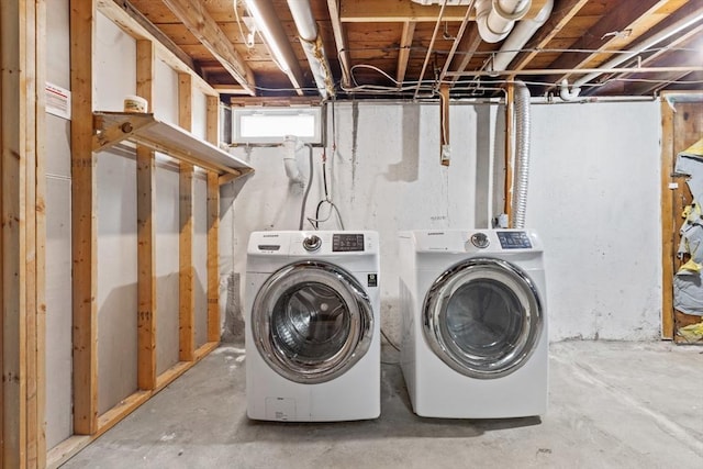 laundry room with washer and clothes dryer and laundry area