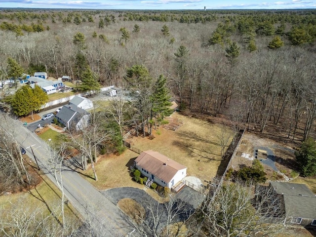 birds eye view of property with a forest view