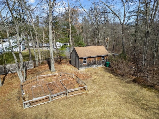 exterior space featuring a wooded view