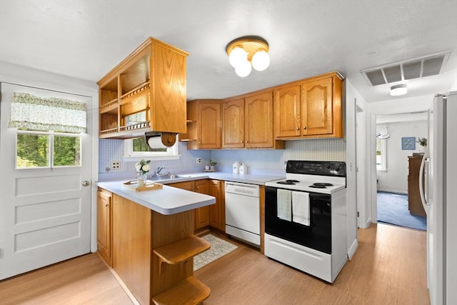 385 Norton Ave, Taunton, MA 02780 - kitchen featuring open shelves, white appliances, light wood-type flooring, and a peninsula