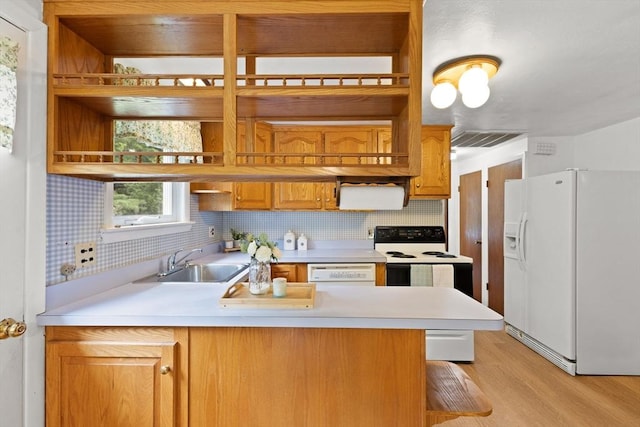 385 Norton Ave, Taunton, MA 02780 - kitchen with white appliances, open shelves, a peninsula, light countertops, and light wood-style flooring