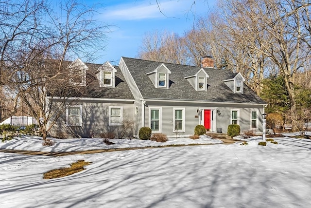 cape cod house featuring a shingled roof