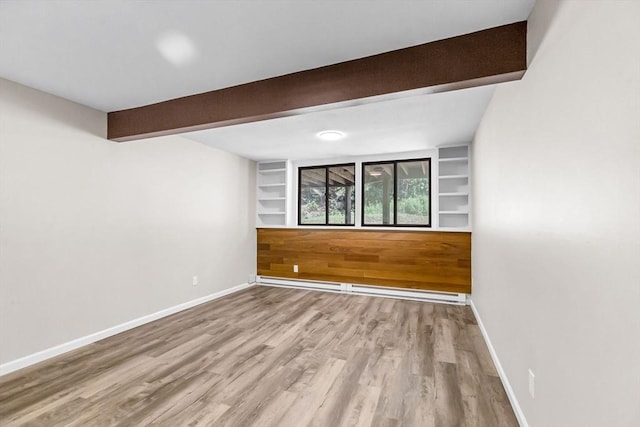 444 Loomis St, Westfield, MA 01085 - spare room with beamed ceiling, wood finished floors, a baseboard heating unit, and built in features