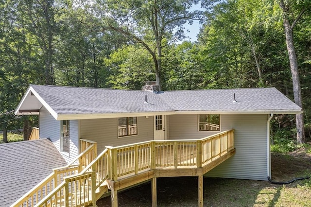 444 Loomis St, Westfield, MA 01085 - rear view of property featuring roof with shingles, a deck, a chimney, and stairway