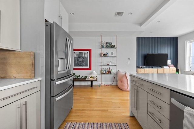 148 Winthrop Shore Dr Unit 4, Winthrop, MA 02152 - kitchen with appliances with stainless steel finishes, light wood-style floors, light countertops, gray cabinetry, and recessed lighting