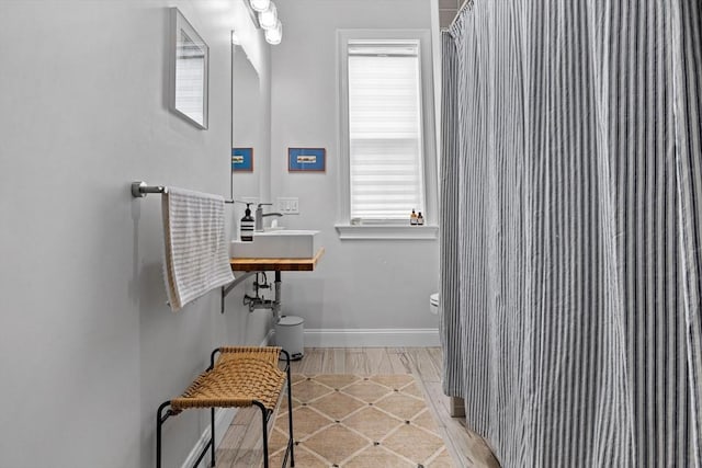 148 Winthrop Shore Dr Unit 4, Winthrop, MA 02152 - full bath with toilet, healthy amount of natural light, baseboards, and a shower with shower curtain