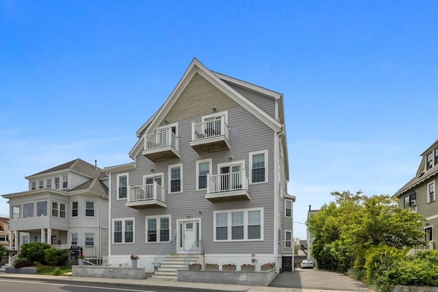 148 Winthrop Shore Dr Unit 4, Winthrop, MA 02152 - view of front of house featuring a balcony and entry steps