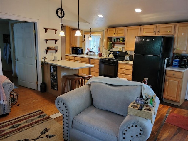 8 Laurel, Lakeville, MA 02347 - kitchen with black appliances, light countertops, light wood-style flooring, light brown cabinets, and recessed lighting