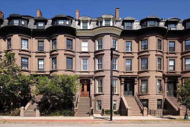 523 Columbus Ave, Boston, MA 02118 - view of front of home with stairway, mansard roof, and a high end roof