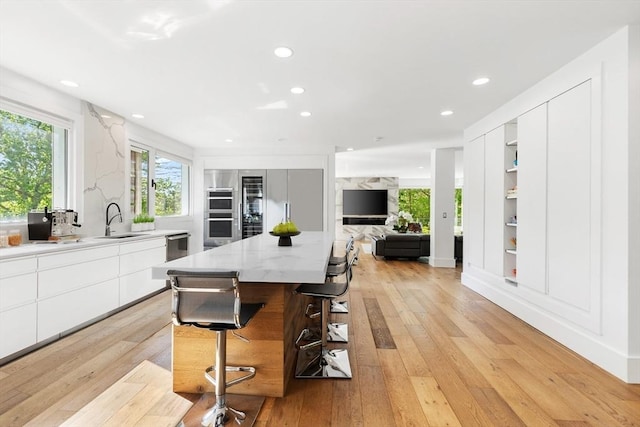 30 Whipple Rd, Lexington, MA 02420 - dining space featuring light wood-type flooring, recessed lighting, and built in shelves