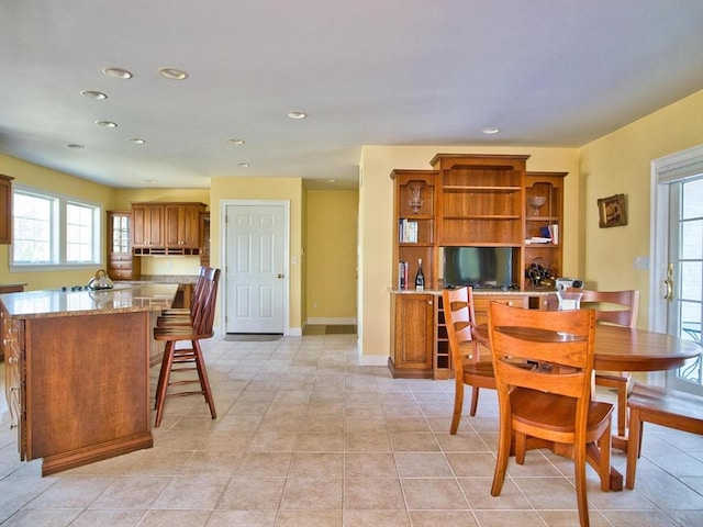 dining area with light tile patterned floors