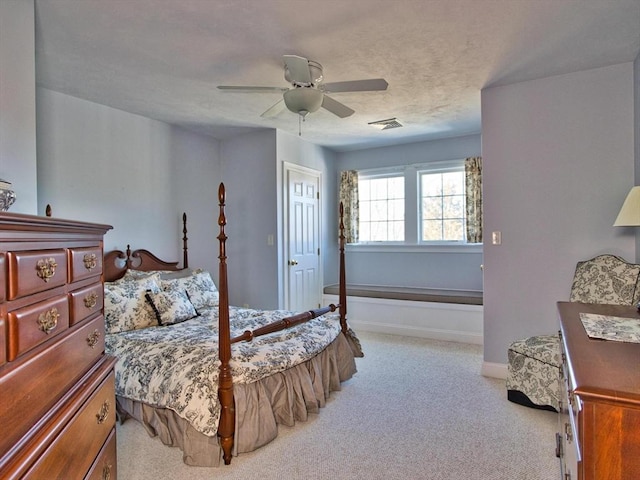 bedroom featuring ceiling fan and light colored carpet