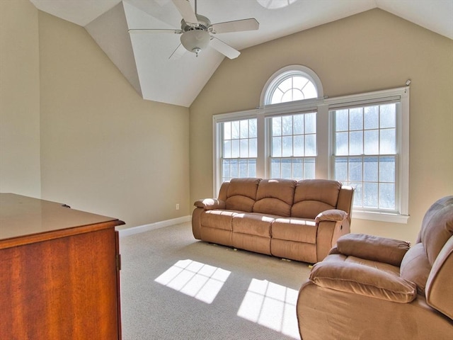 living room featuring light carpet, ceiling fan, and lofted ceiling