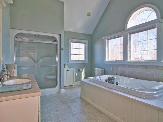 full bathroom with vanity, separate shower and tub, toilet, and vaulted ceiling