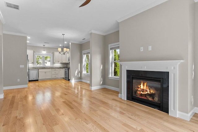 4 Emerald Way Unit 4, Salisbury, MA 01952 - unfurnished living room featuring ceiling fan, a glass covered fireplace, light wood-style flooring, recessed lighting, and ornamental molding