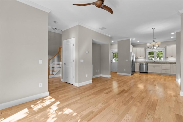 4 Emerald Way Unit 4, Salisbury, MA 01952 - unfurnished living room featuring a ceiling fan, stairway, a chandelier, ornamental molding, and light wood-style floors